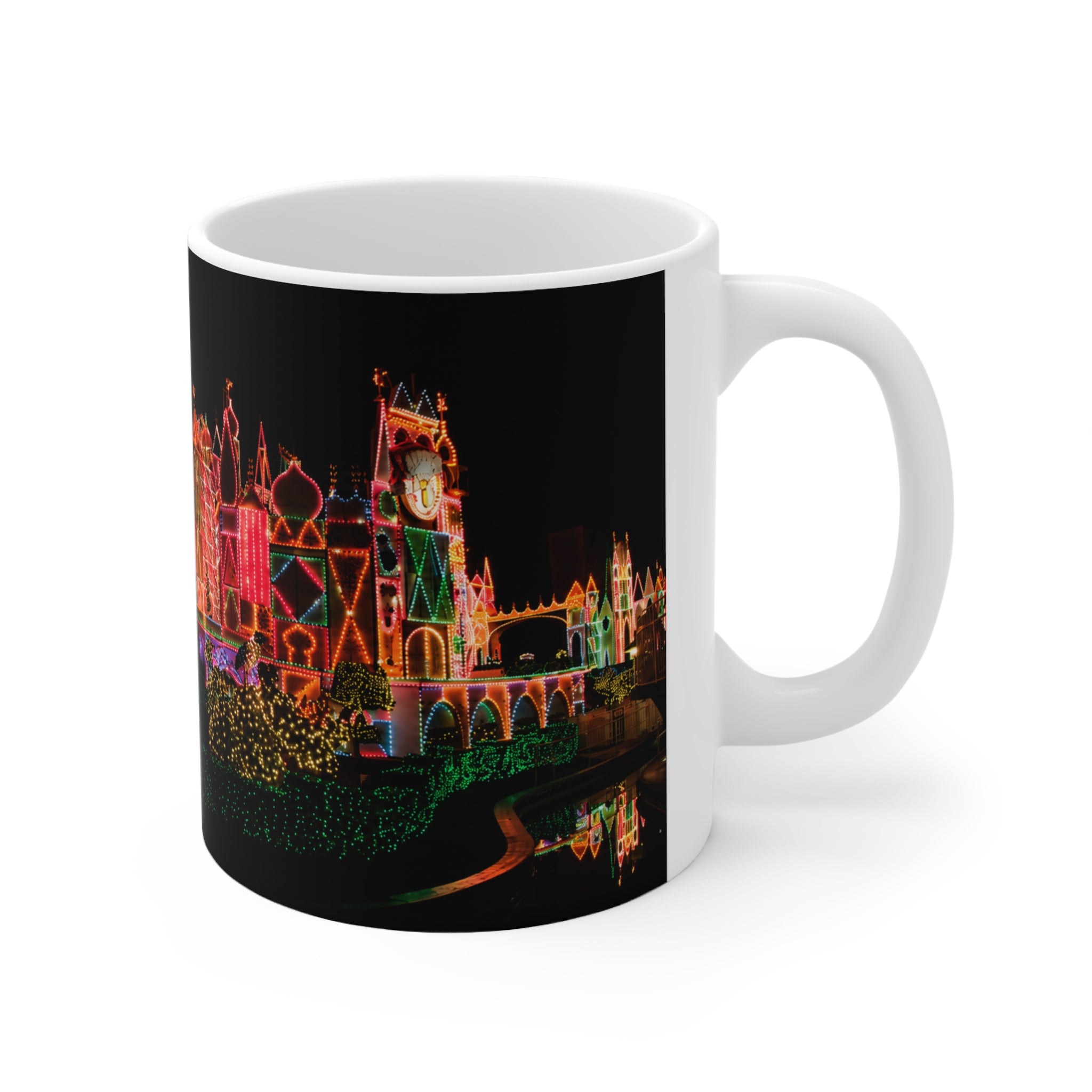 Disneyland It's a Small World Taken at night Ceramic Mug — Festive Neon Christmas Coffee Cup (11oz & 15oz)