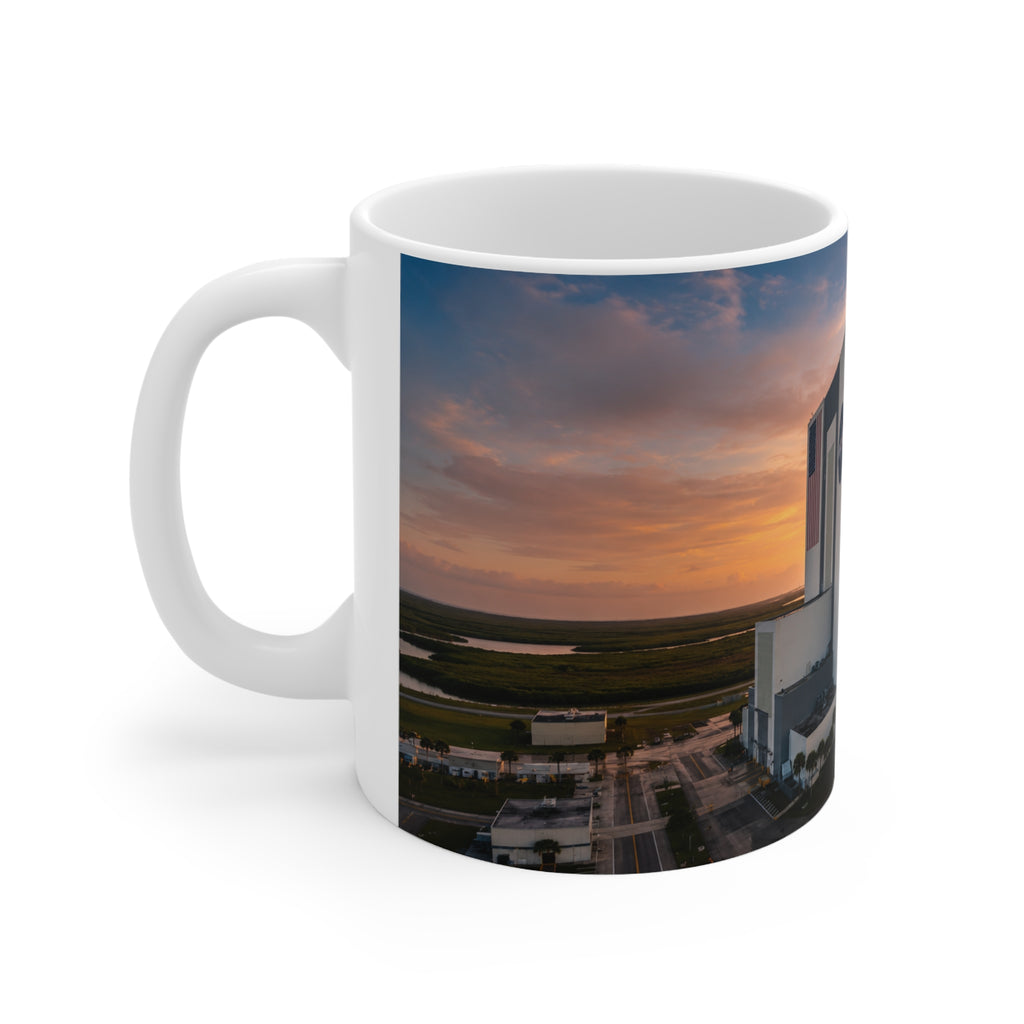 NASA Vehicle Assembly Building Sunrise Photo Mug — American Flag Ceramic Coffee Cup (11oz & 15oz)